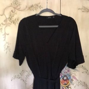 Knee length black dress.